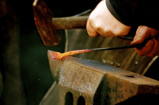 blacksmith bending metal